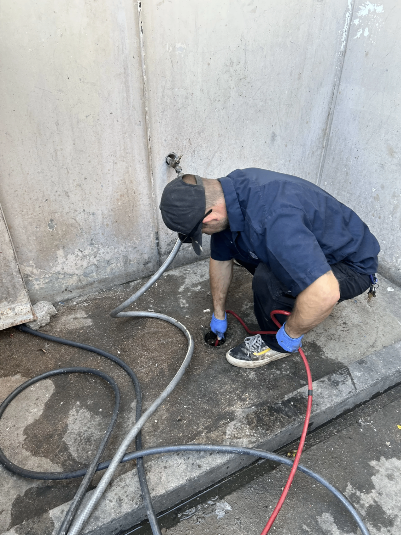 SpeeDee plumber hydro-jetting a commercial floor drain in Fullerton, CA
