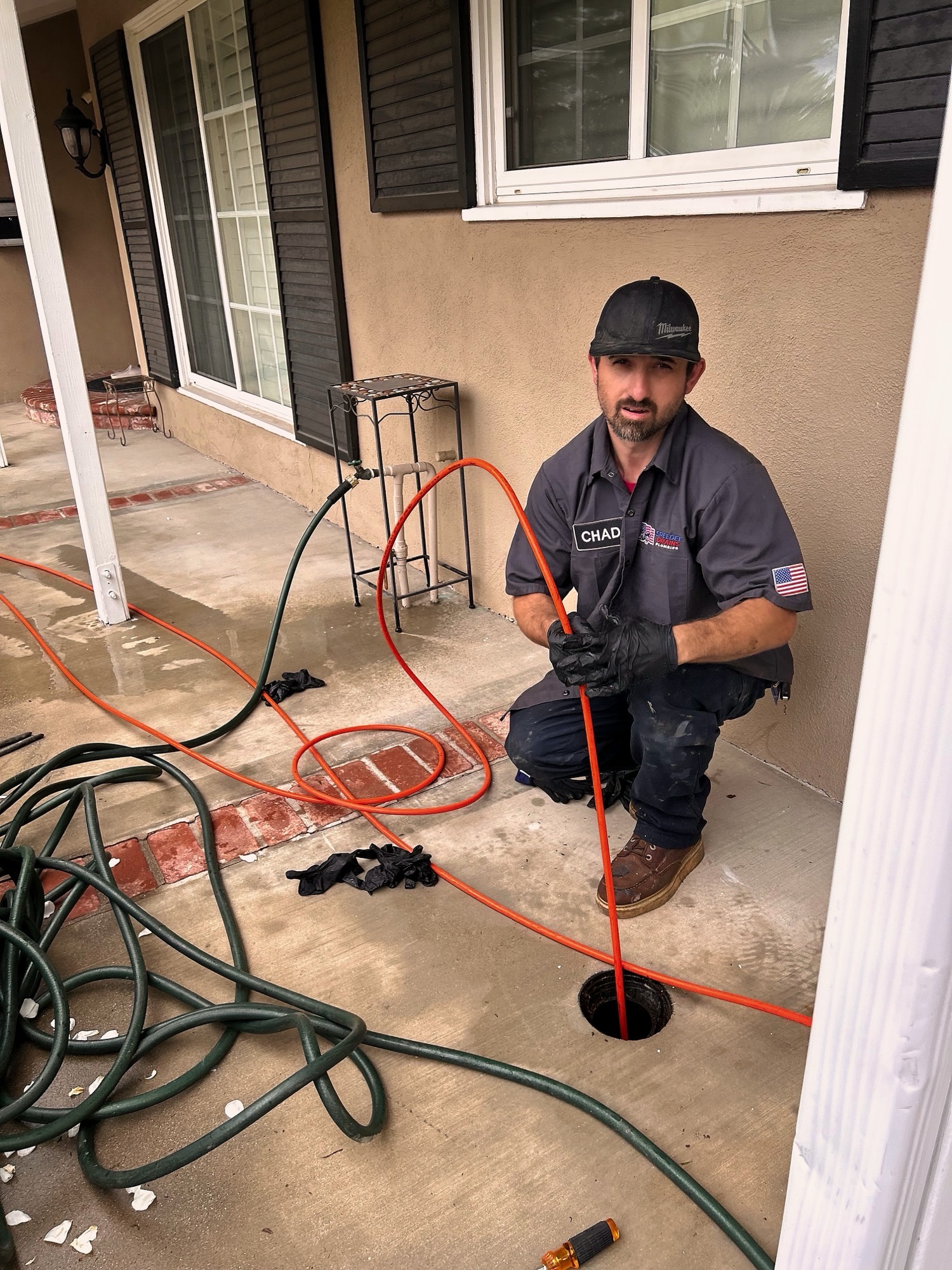Speedee Drains technician performing hydro jetting on a sewer line